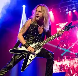 Faulkner performing with Judas Priest in 2015