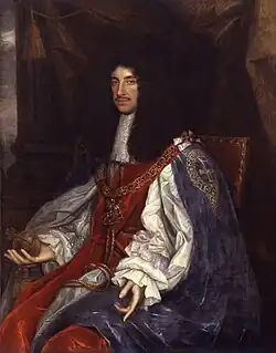 Charles is of thin build and has chest-length curly black hair