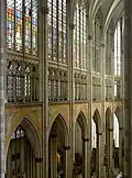 The interior of Cologne Cathedral shows three stages:- the arcade at the lowest level, the gallery in the middle and the clerestory windows.