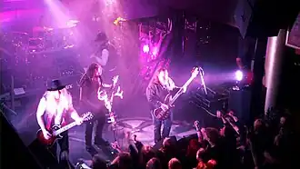 Korpiklaani playing music at a concert in 2011