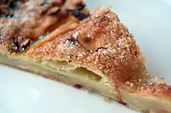 A slice of a kringle with remonce, a type of Danish pastry common in Denmark