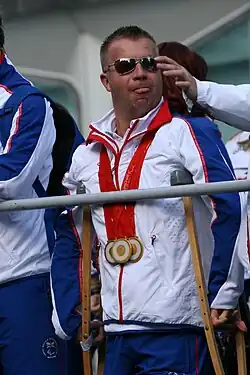 Image of Pearson wearing three gold medals