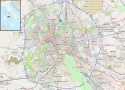 Map showing the various buildings and structures of Vatican City in purple with a red dot indicating the location of St. Peter's Basilica