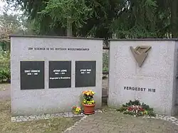 Triangular symbol on a memorial to victims killed at Genshagen (right panel)