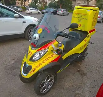 MDA Piaggio MP3 three-wheeled scooter.