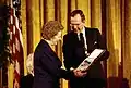 Former United Kingdom Prime Minister Margaret Thatcher receiving the Presidential Medal of Freedom from President George H. W. Bush in 1991