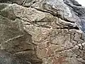 This rock-face in France contains the mineral Mica.
