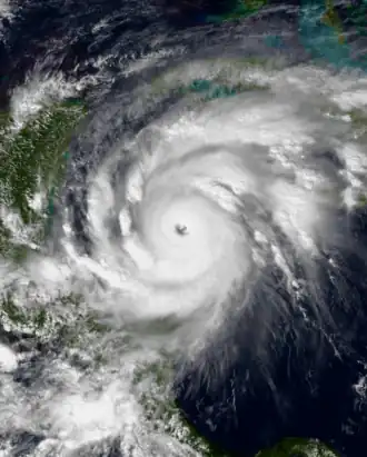 Satellite image of an intense tropical cyclone over the Western Caribbean Sea with an large and well defined eye.