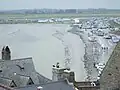 The causeway connecting Mont Saint-Michel to the mainland, responsible for the massive buildup of mud and sediment in the area
