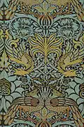 This fabric design 'Peacock and Dragon', the work of William Morris (1878), is a beautiful example of decorative graphic design.