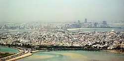 View of  Muharraq with the skyline of Manama in the background
