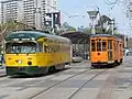 A PCC streetcar and an ex-Milan streetcar on the F Market & Wharves line at the Ferry Building.