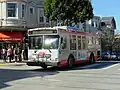 A 30-foot (9.1&nbsp;m) route 37 Corbett bus in Cole Valley, San Francisco