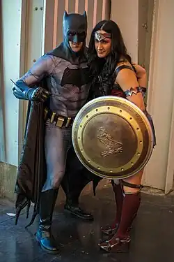 Cosplayer dressed as DCEU Batman in his main suit with another cosplayer dressed as DCEU Wonder Woman