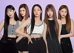 Image of NewJeans members dressed in black and white