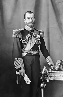 Nicholas is pale-eyed, bearded, of slim build and wearing a uniform and medals.