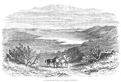 Men viewing a distant lake