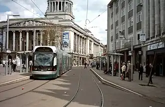 An Incentro AT6/5 tram destined for the former Station Street stop (now Nottingham Station) waits in the southbound platform of Old Market Square stop.