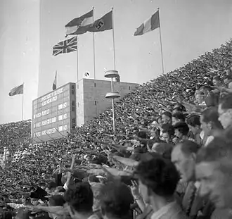 Spectators giving the Nazi salute during a medal ceremonies