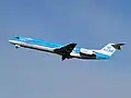 A KLM Cityhopper Fokker 100 taking off Amsterdam.
