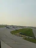 Planes lined up at the airport.