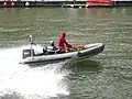 Divers of the BSPP in a light boat on the river Seine.