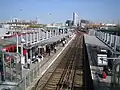 Overview of the platforms looking east from glass-walled footbridge