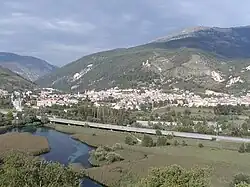 A view of a spring of the Pescara, with Popoli in the background