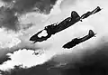 Soviet Ilyushin Il-2 planes with 23mm cannons attacking a German tank column during the Battle of Kursk.