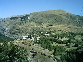 The village of Rabou and the summit of Puy, at 1,834&nbsp;m (6,017&nbsp;ft)