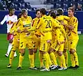 Players celebrating a goal versus Red Bull Salzburg