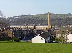 Saltaire village in the foreground with Salt's Mill in the background