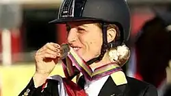 Image of Morganti smiling and holding a medal