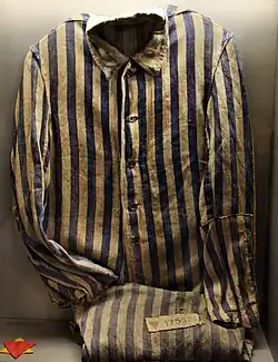 A Sachsenhausen detainee's uniform. The red triangle atop a yellow triangle (at bottom left) marked the prisoner as a Jewish political enemy