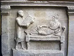 Relief of a slave (at left) in Ancient Rome.  The Roman Empire often made POWs into slaves