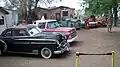Juan Delgadillo's collection of old Chevrolets. Pictured l to r:  1950 Deluxe coupe, 1966  half-ton pickup, unidentified fender, 1950 half-ton pickup, 1970 Impala hardtop, 1939 one-ton fire truck