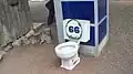 Toilet and phone booth displayed for fun