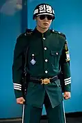 A South Korean MP stands guard in the JSA conference center.