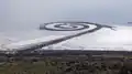 Robert Smithson's Spiral Jetty (1970) on the Great Salt Lake in Utah. With black basalt and earth from the site, he made a design 1,500 feet long and 15 feet wide.