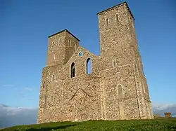 Looking up at Reculver towers from close by on a sunny day