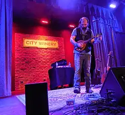 Steve Earle performing on a mandolin at the City Winery Chicago in February 2015