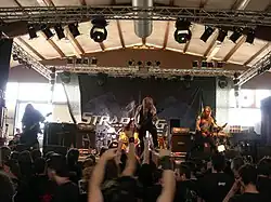 Strapping Young Lad in 2006, left to right: Byron Stroud, Gene Hoglan (shown back with drums), Devin Townsend and Jed Simon.