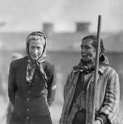 A liberated Bergen-Belsen survivor (left) with a late war ersatz. Instead of wearing a cloth badge, this survivor had to wear a large N on her outer clothes