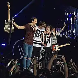The Vamps performing at the O2 Arena in London during their Wake Up World Tour, in April 2016.(L-R: James Brittain-McVey, Tristan Evans, Connor Ball and Brad Simpson)