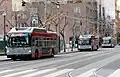 Route 21 Hayes and 31 Balboa trolleybuses at Ferry Plaza in 2019.