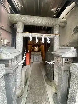 Torii gate and interior view of the shrine grounds