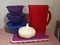 A Tupperware pitcher and bowls