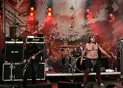 Turbonegro performing at Vikafestivalen, Mo i Rana, Norway on 22 July 2004. (L-R) Euroboy, Chris Summers, and Hank von Helvete