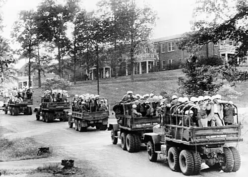 U.S. Army trucks drive across the University of Mississippi campus on October 3, 1962