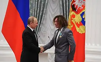 Valery Leontiev receives the 'Order of Friendship' from Russian president Vladimir Putin.